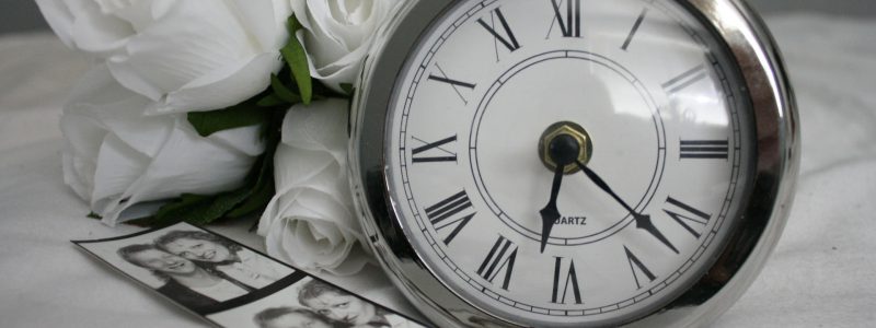 pocket watch with white roses and photographs