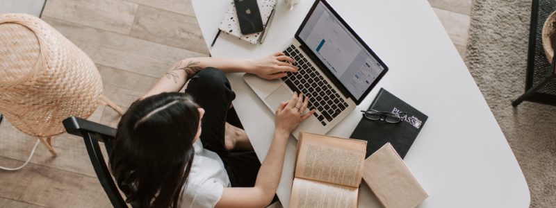 woman writing a response to a Caveat Warning